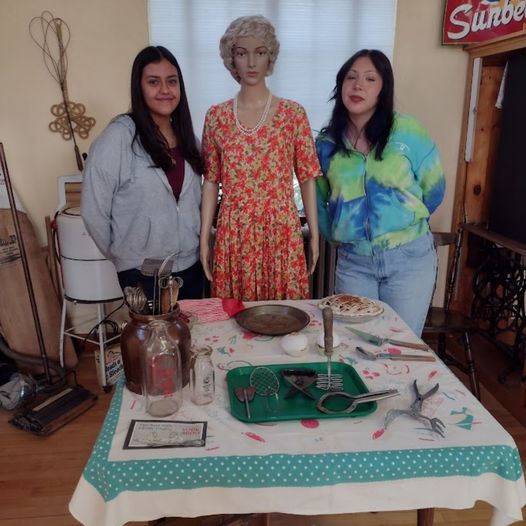 women taking a picture with a wax figure at Fort Lupton History Museum