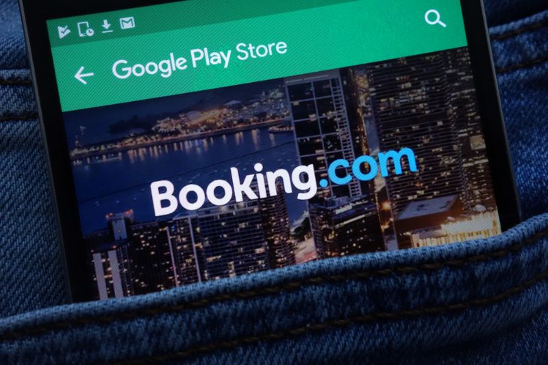 Booking.com on a mobile inside a denim pocket
