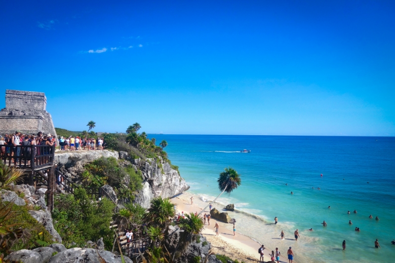 Tulum's UNESCO-listed Mayan ruins, overlooking the clear blue Caribbean sea and white sand beaches of Mexico's Yucatan Peninsula
