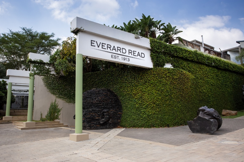 Exterior of art gallery building with plants growing on the walls.