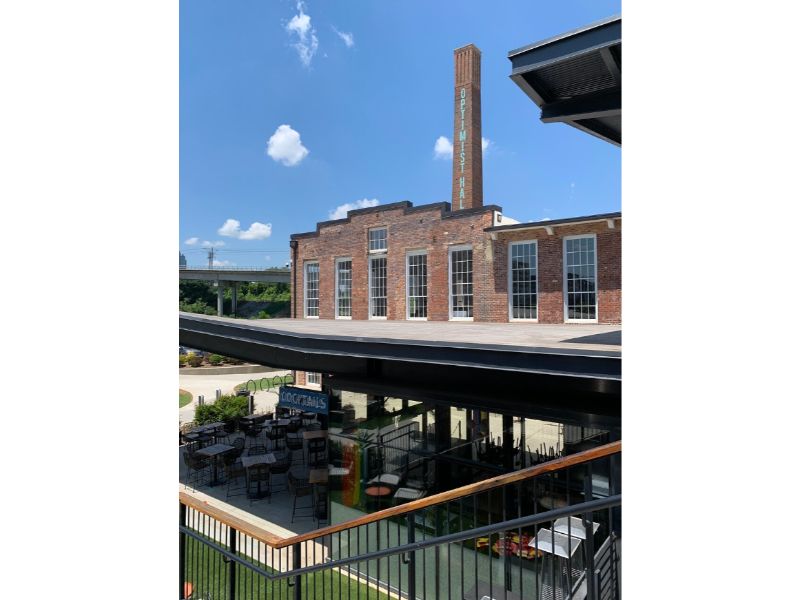 Optimist Hall is a renovated historic textile mill turned into a food hall, gathering space, and event venue.