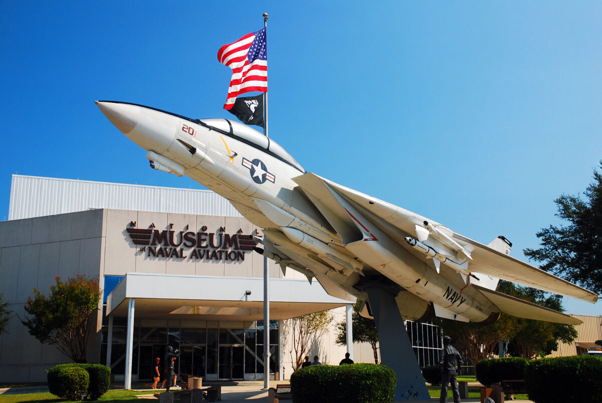 A twin engine Grumman F14 Tomcat fighter jet stands in front of the Museum of Naval Aviation in Pensacola, Florida