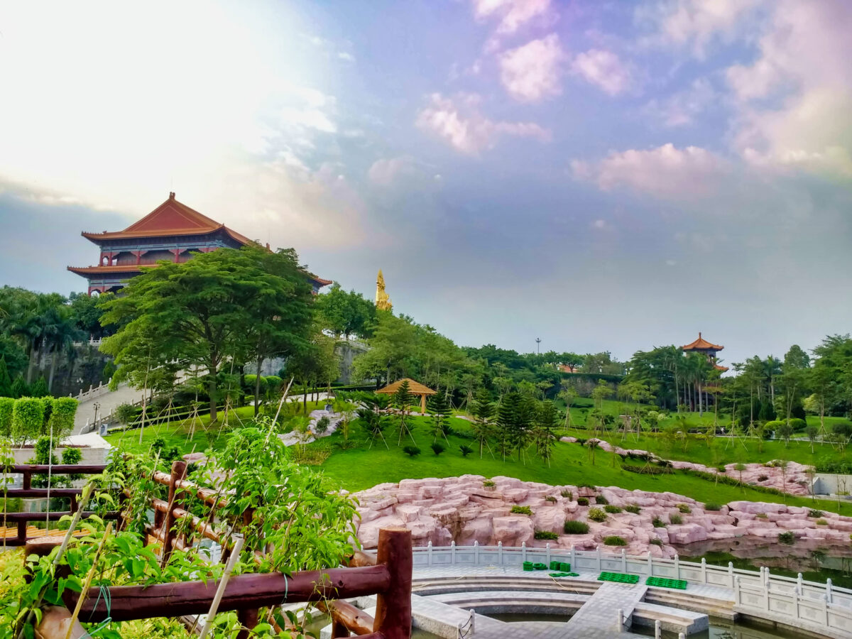 Temple and Pagoda in Park Lotus Mountain. Green Trees and blue sky. Guangzhou. Guangdong. China. Asia.