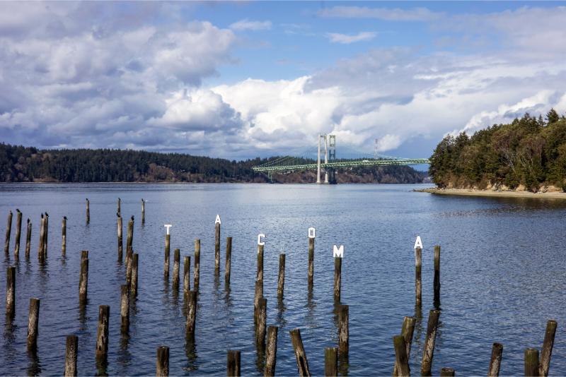 Titlow Park presents an exceptional waterfront experience with beach access and trails.