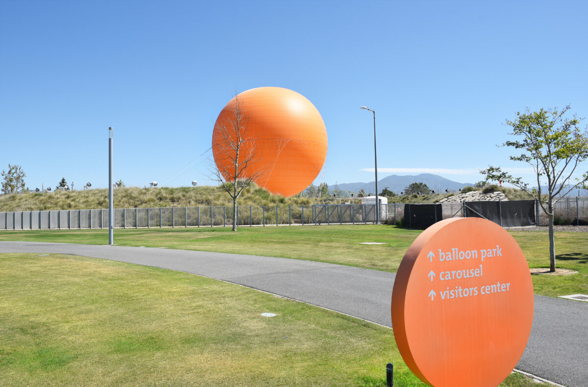 Directions sign and Tethered Balloon at the Great Park in Irvine. The Great Park attraction provides visitors with an aerial view of the region.