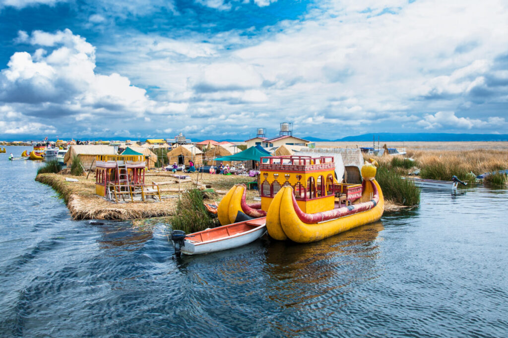 Boats and village in Lake Titicaca, Peru
