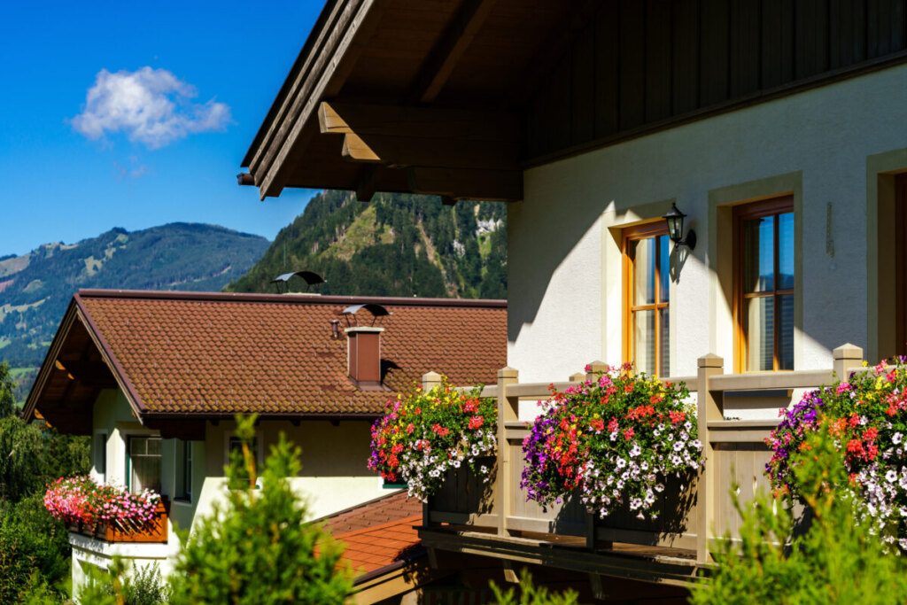 Exterior of a beautiful guesthouse by the mountains in Austria