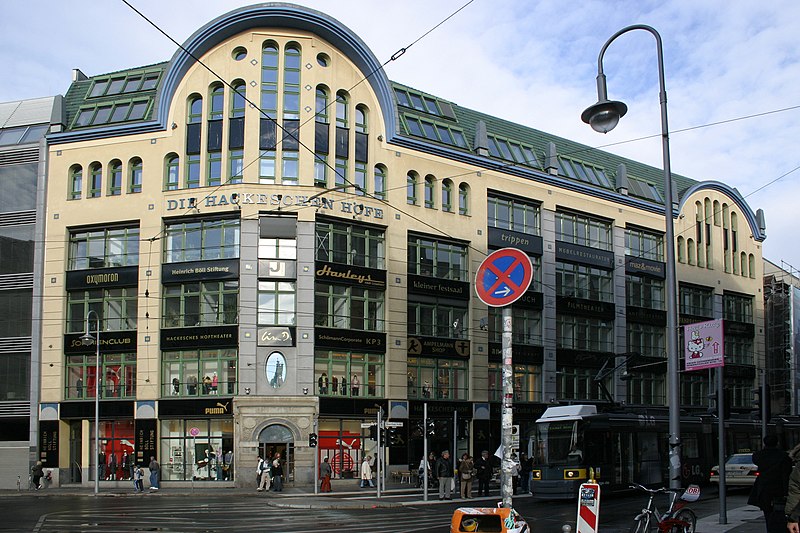 Hackesche Höfe in Berlin, Germany, a series of interconnected courtyards with historic architecture, trendy shops, and outdoor cafes.