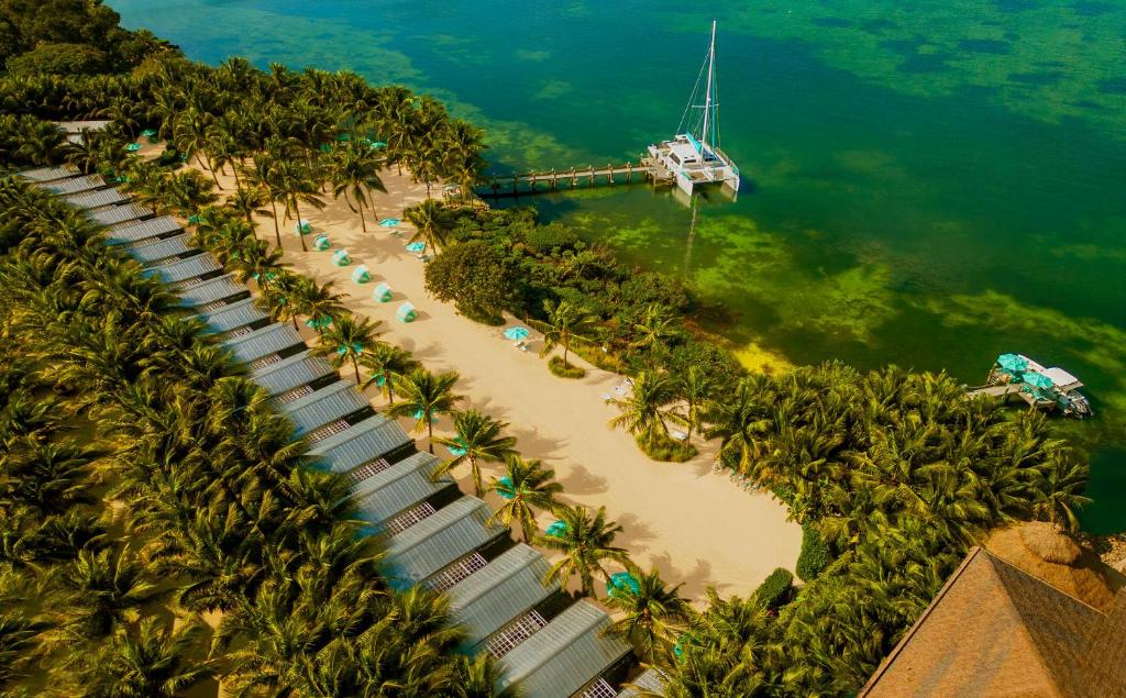 Aerial view of luxury overwater bungalows at sunset in Key Largo Florida