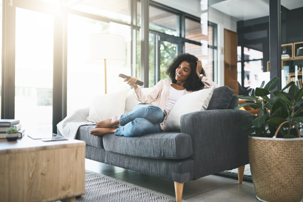 Woman smiling while couch surfing