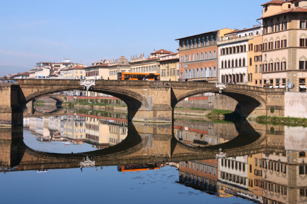 Bus passing by the Ponte Santa Trinita bridge in Florence, Italy