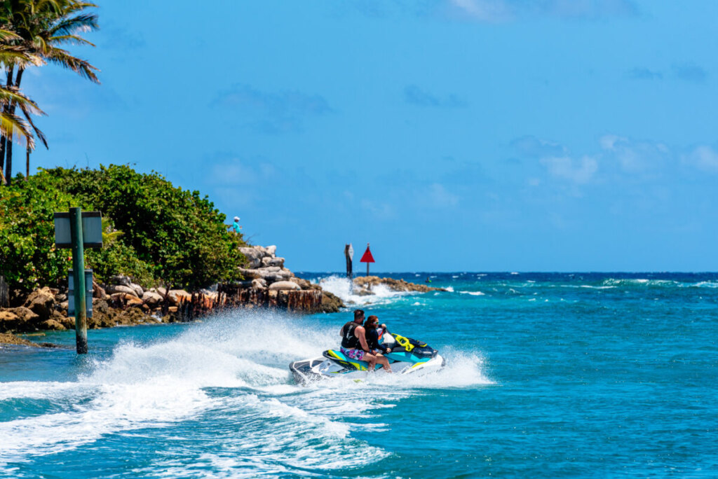 Couple enjoying jet ski adventure in Florida Keys crystal clear waters