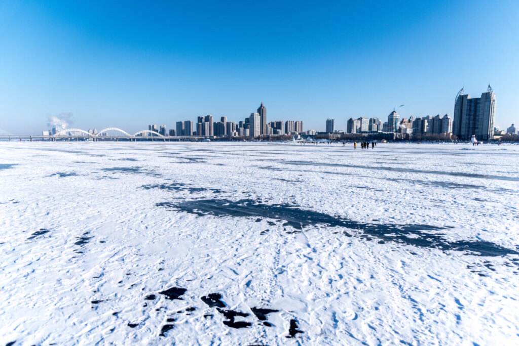 Frozen river and buildings in Harbin, Heilongjiang, China