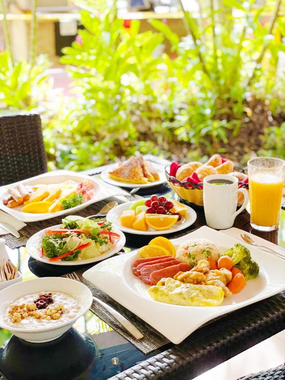 Gourmet breakfast spread at Hilton Guam Resort featuring tropical fruits and local specialties