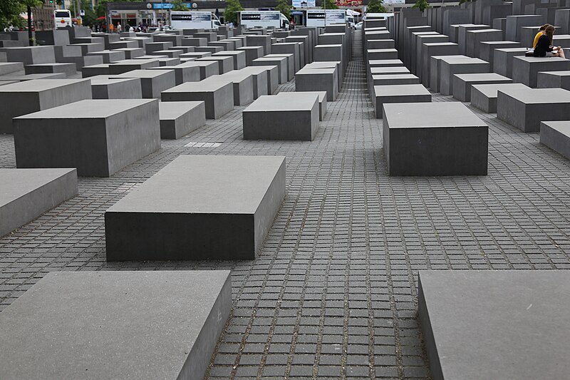Holocaust Memorial (Memorial to the Murdered Jews of Europe) in Berlin, Germany, a field of concrete slabs of varying heights, symbolizing a somber and impactful remembrance.