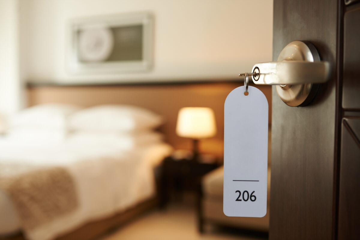 Entering hotel room door and a key for room 206