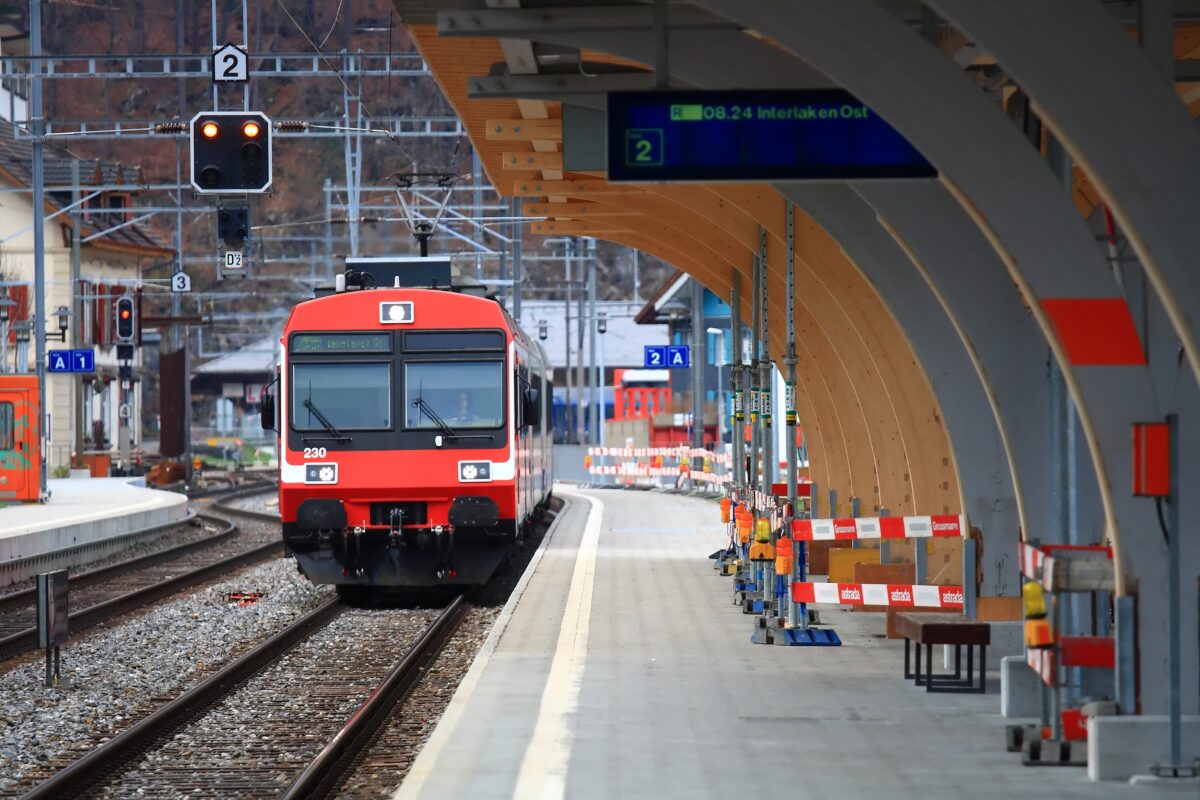 Red train at Interlaken Switzerland station showing operational service during non-strike period