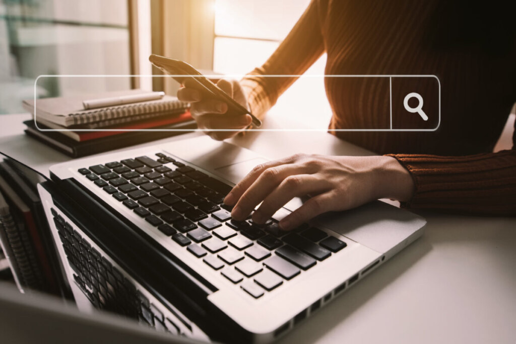 Woman doing an online search using a laptop
