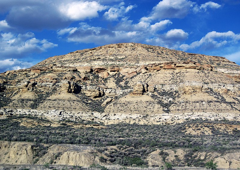 Rock Springs, Wyoming, a bustling city surrounded by high desert landscapes and coal-mining history, featuring the iconic 'White Mountain' formation in the distance.