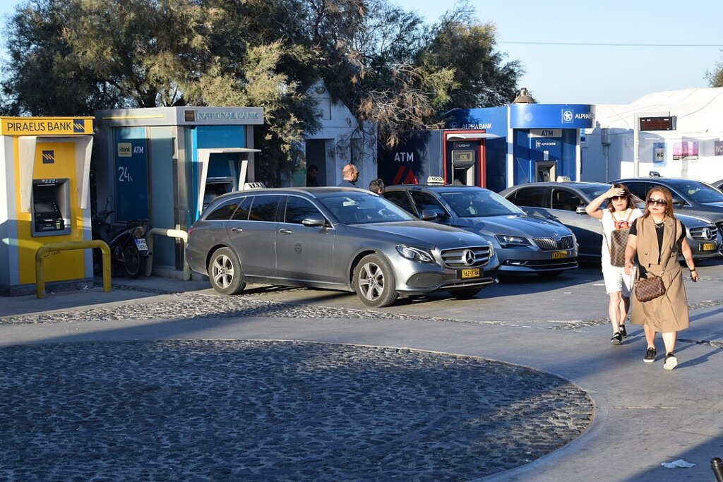 Parks cars and taxis in Santorini, Greece