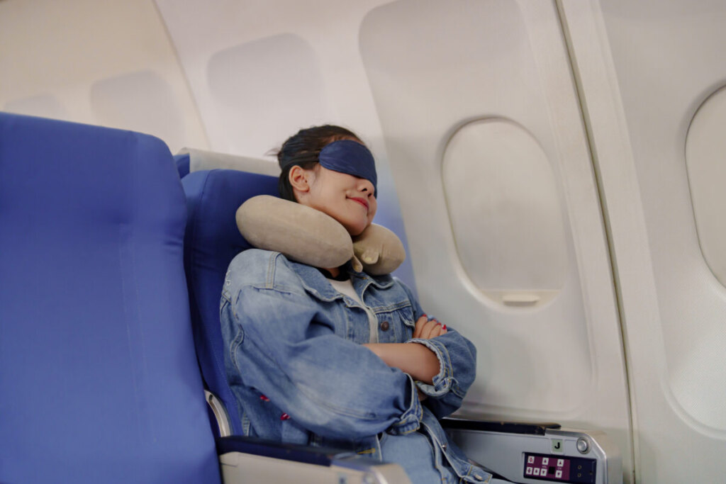 Female passenger sleep on plane flight