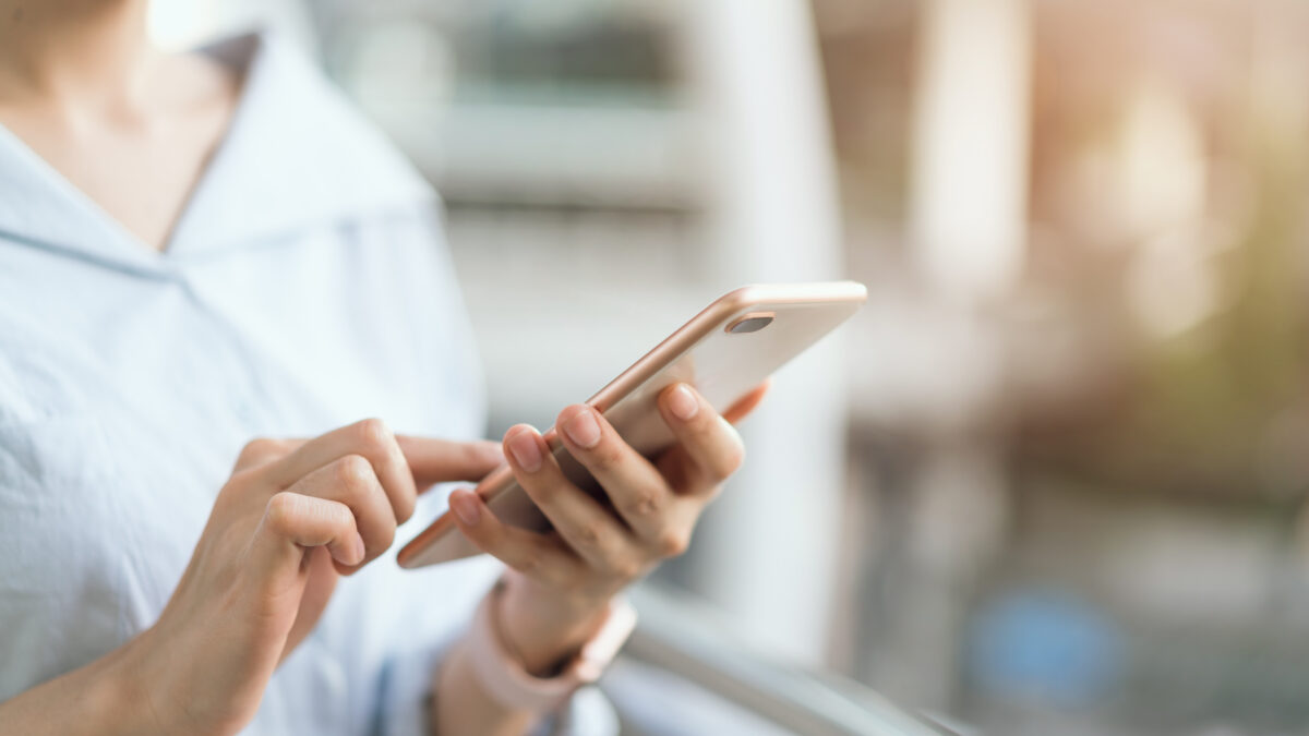 Woman using a smartphone to send a message