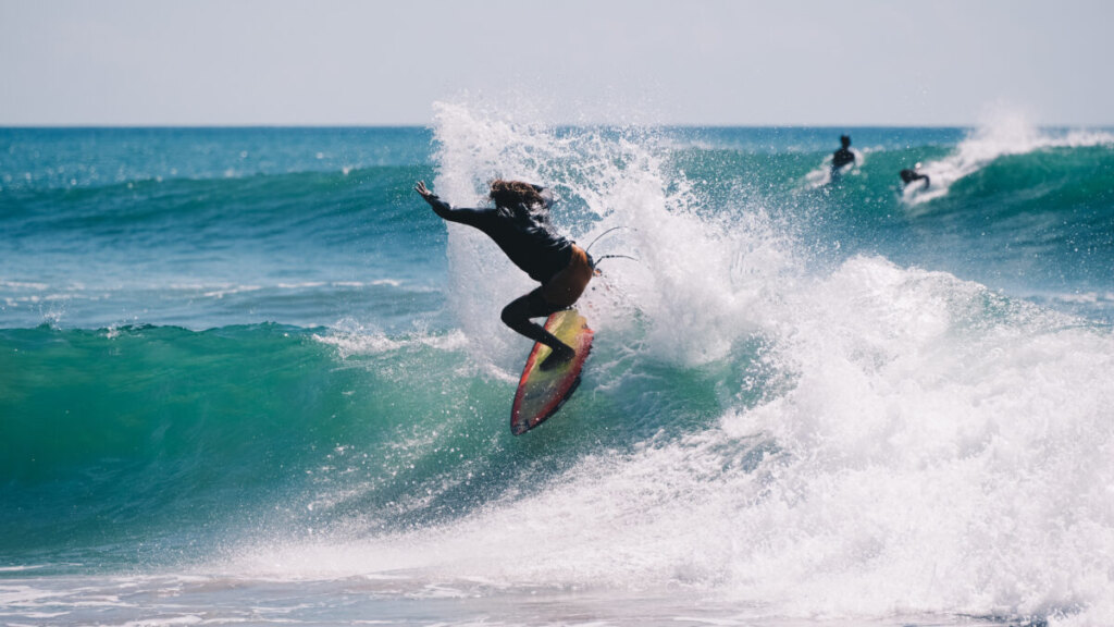 Man surfing on a huge wave