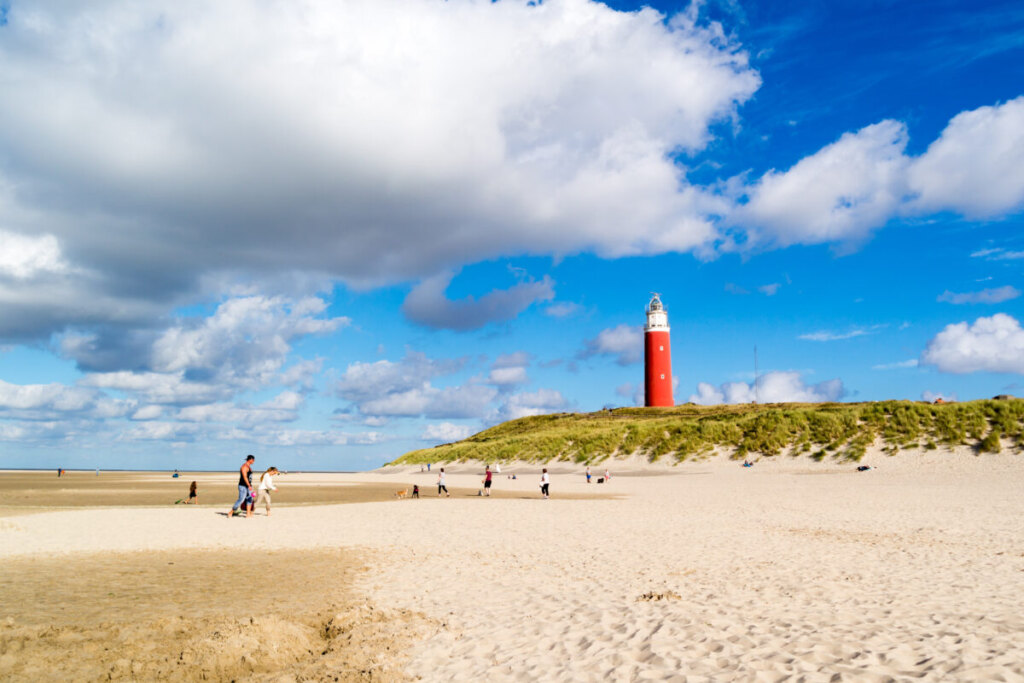 Panoramic view of a scenic beach and the lighthouse in Texel Island, Netherlands