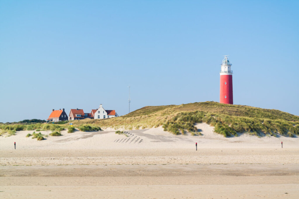 Panoramic view of the beach and lighthouse De Cocksdorp in Texel, Netherlands