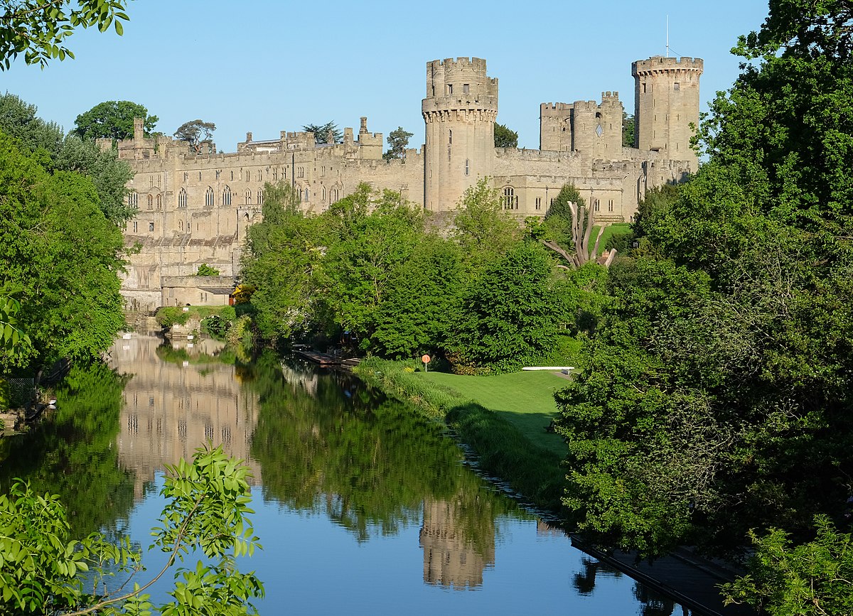 Warwick Castle from the bridge over the River Avon, Warwick, Warwickshire, UK.